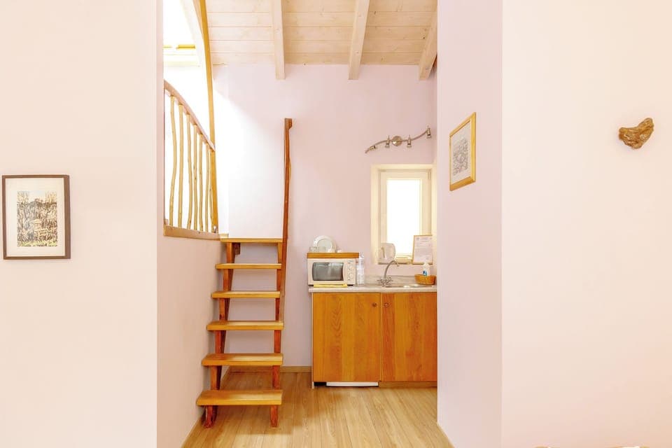 Deluxe Quadruple Room | In-room safe, desk, blackout drapes, soundproofing