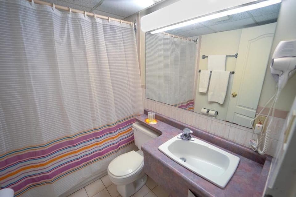 Combined shower/tub, hair dryer, towels, soap