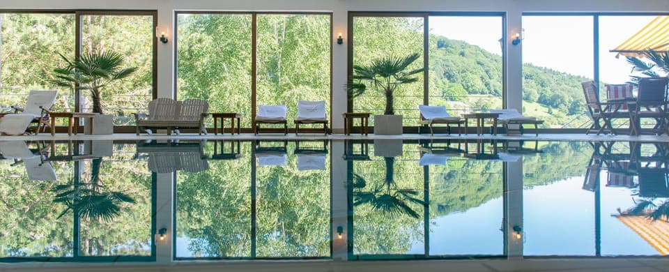 Indoor pool, seasonal outdoor pool, pool umbrellas, sun loungers