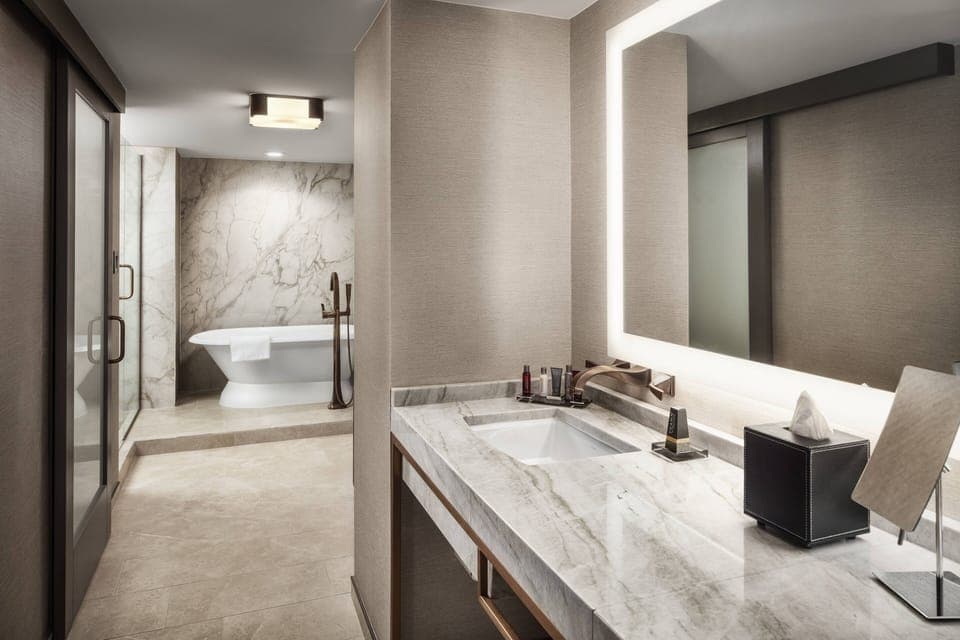 Combined shower/tub, designer toiletries, hair dryer, towels