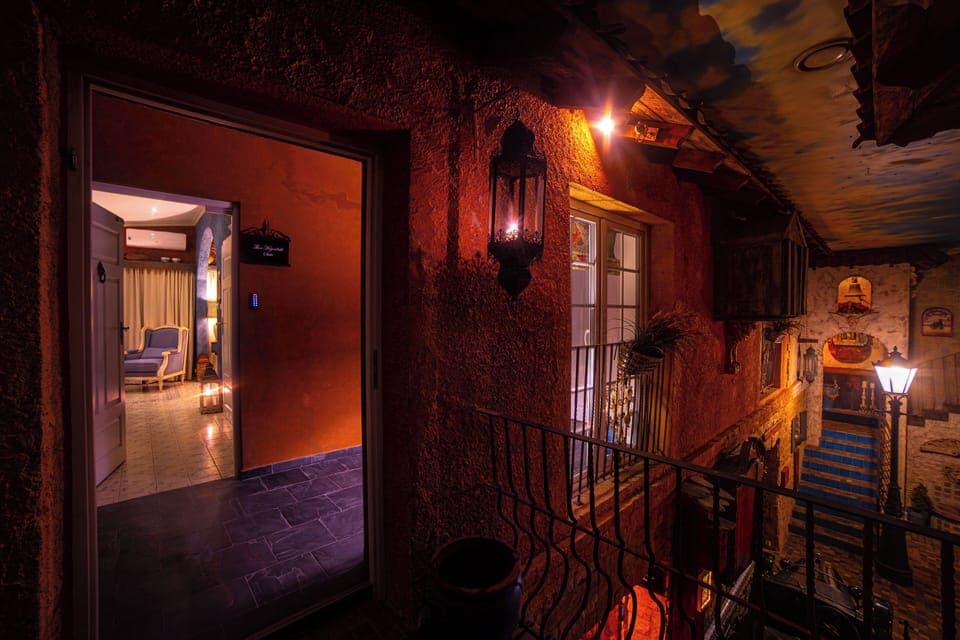 Superior Suite, 1 Queen Bed, Private Bathroom, Courtyard Area | In-room safe, blackout drapes, iron/ironing board, free WiFi