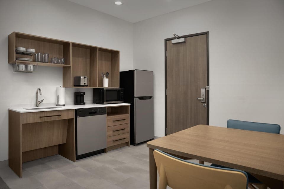 Suite, 1 King Bed, Accessible (Roll-In Shower) | Private kitchen | Coffee/tea maker
