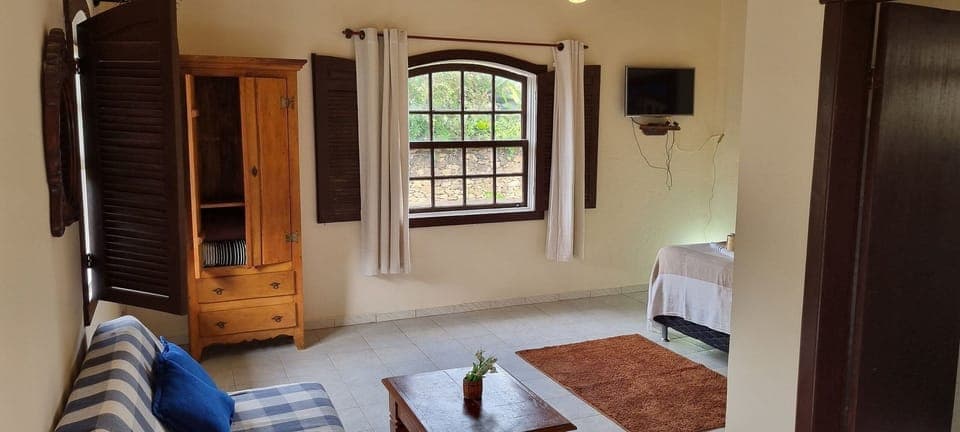 Basic Apartment | Living area | 32-inch flat-screen TV with satellite channels