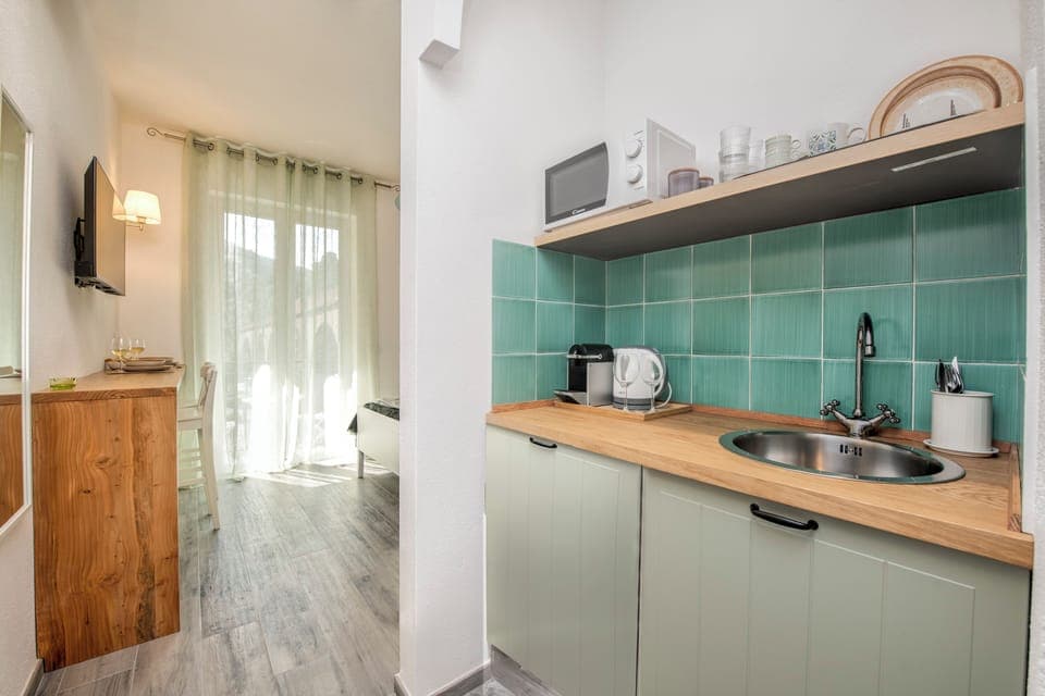 Superior Room, Kitchenette | Blackout drapes, iron/ironing board, free WiFi