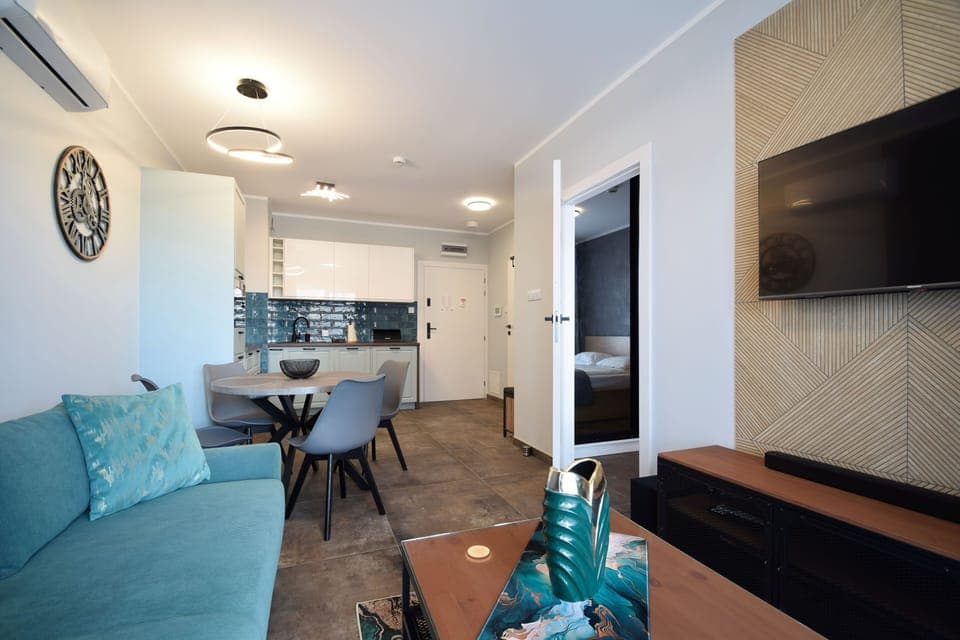 Comfort Apartment, Balcony | Living room | Flat-screen TV