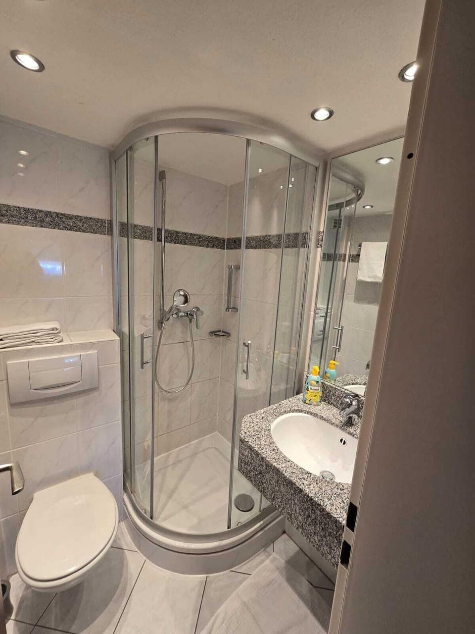 Shower, towels, toilet paper