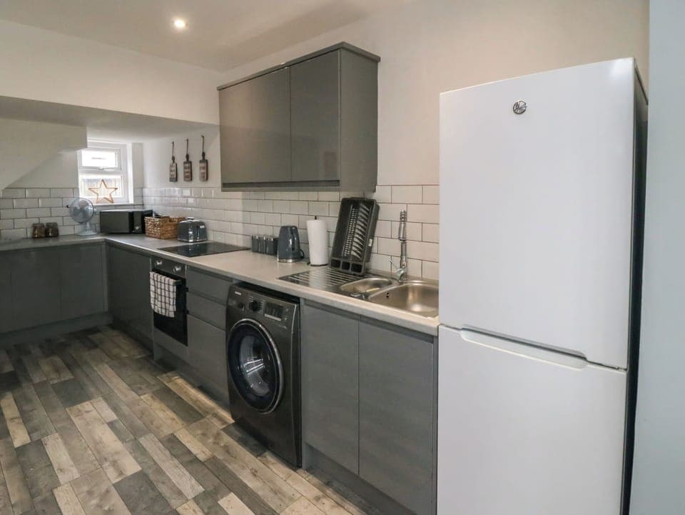 Fridge, electric kettle, cookware/dishes/utensils