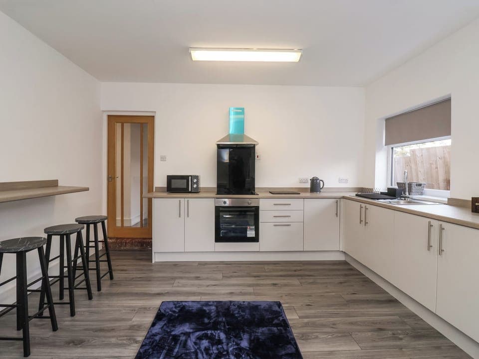 Fridge, electric kettle, cookware/dishes/utensils