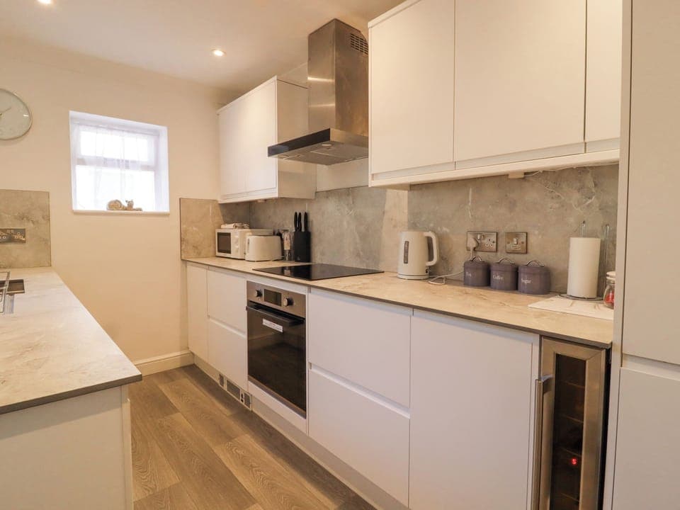 Fridge, electric kettle, cookware/dishes/utensils