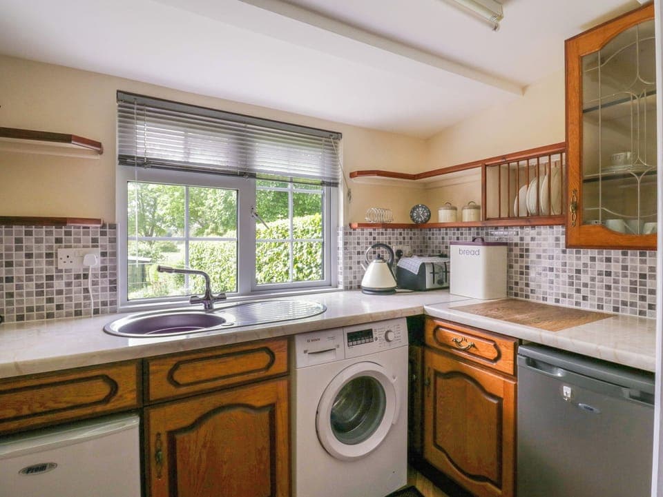 Fridge, electric kettle, toaster, cookware/dishes/utensils