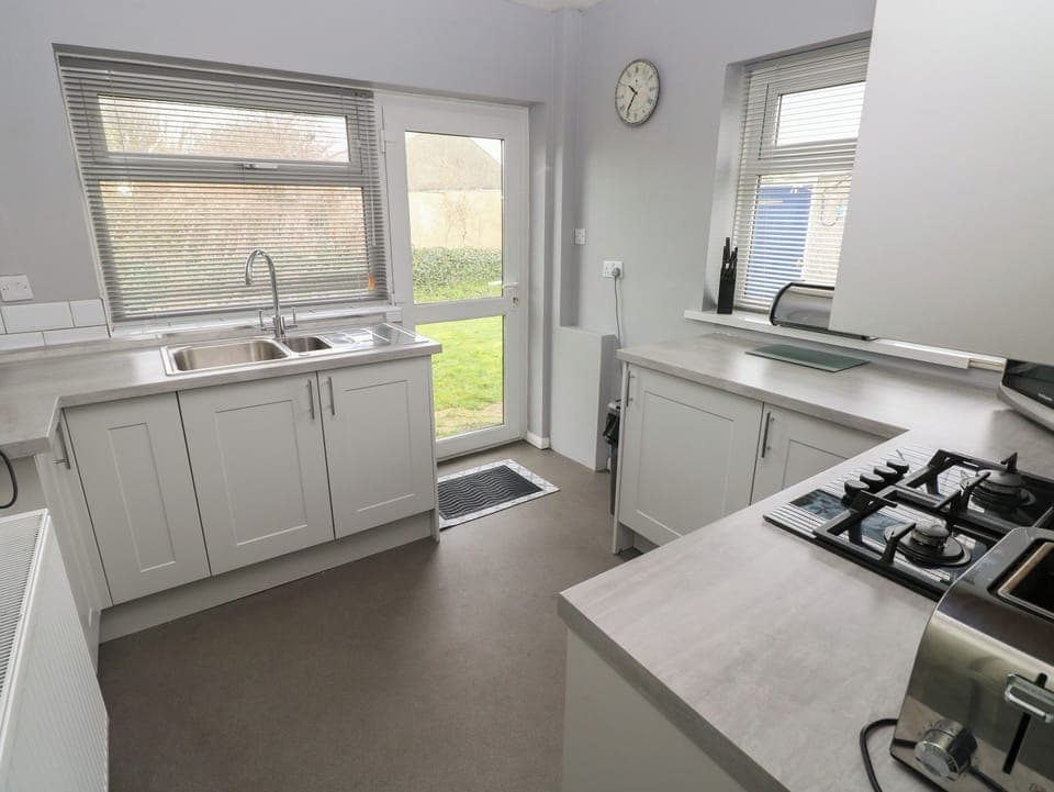 Fridge, electric kettle, toaster, cookware/dishes/utensils