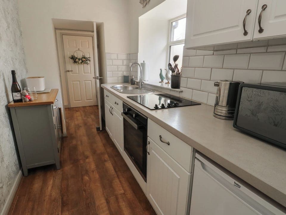 Fridge, electric kettle, toaster, cookware/dishes/utensils