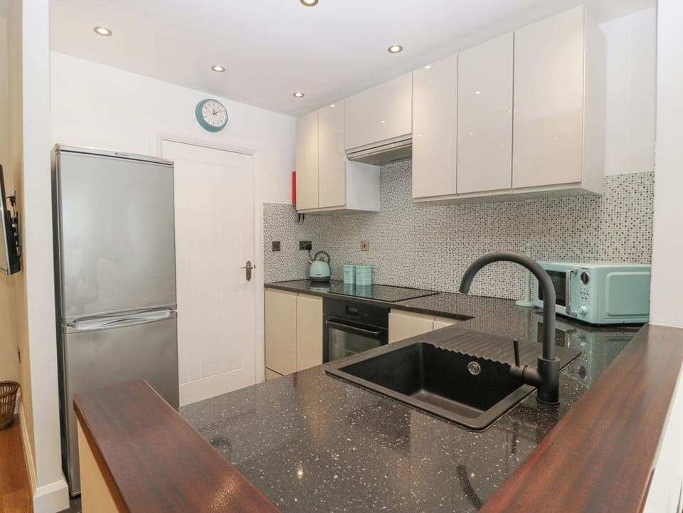 Fridge, dishwasher, electric kettle, cookware/dishes/utensils