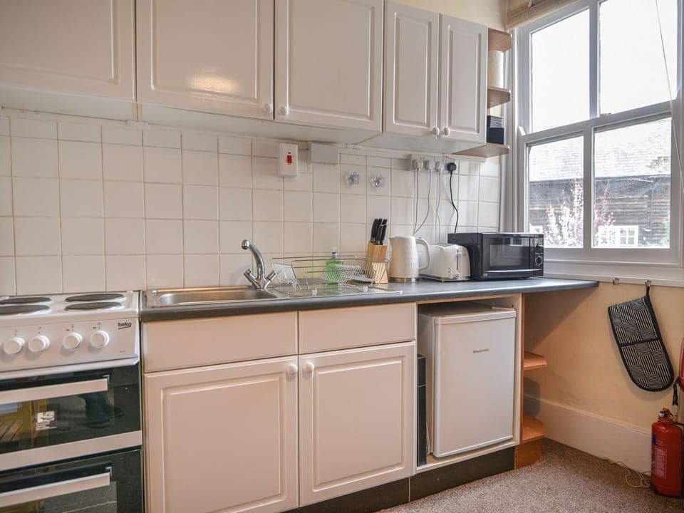 Fridge, electric kettle, toaster, cookware/dishes/utensils