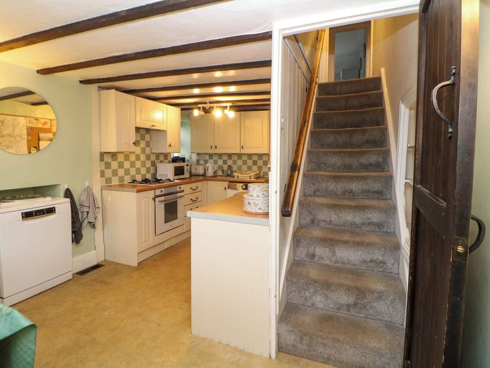 Fridge, electric kettle, toaster, cookware/dishes/utensils