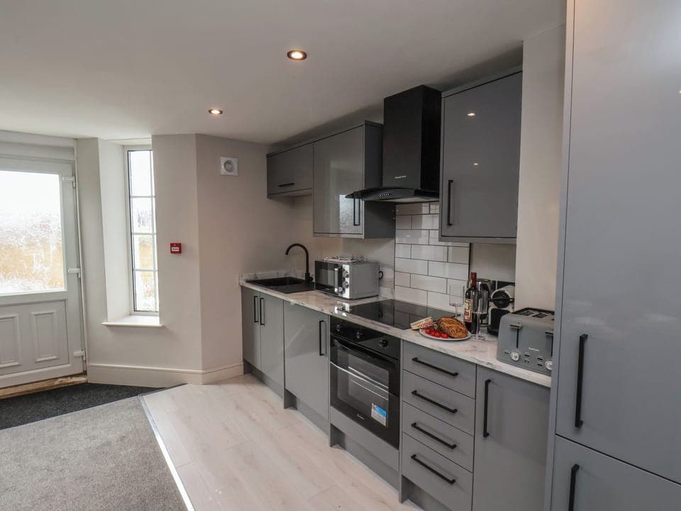 Fridge, electric kettle, toaster, cookware/dishes/utensils