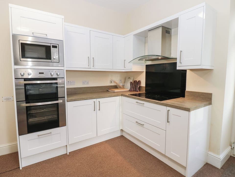 Fridge, dishwasher, electric kettle, cookware/dishes/utensils