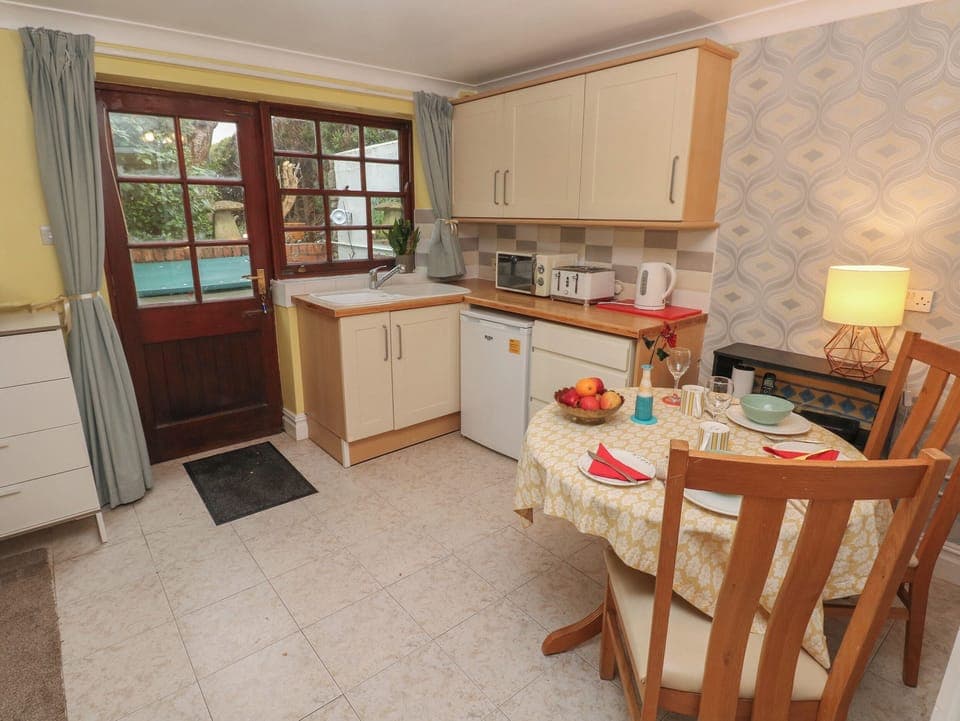 Fridge, electric kettle, toaster, cookware/dishes/utensils