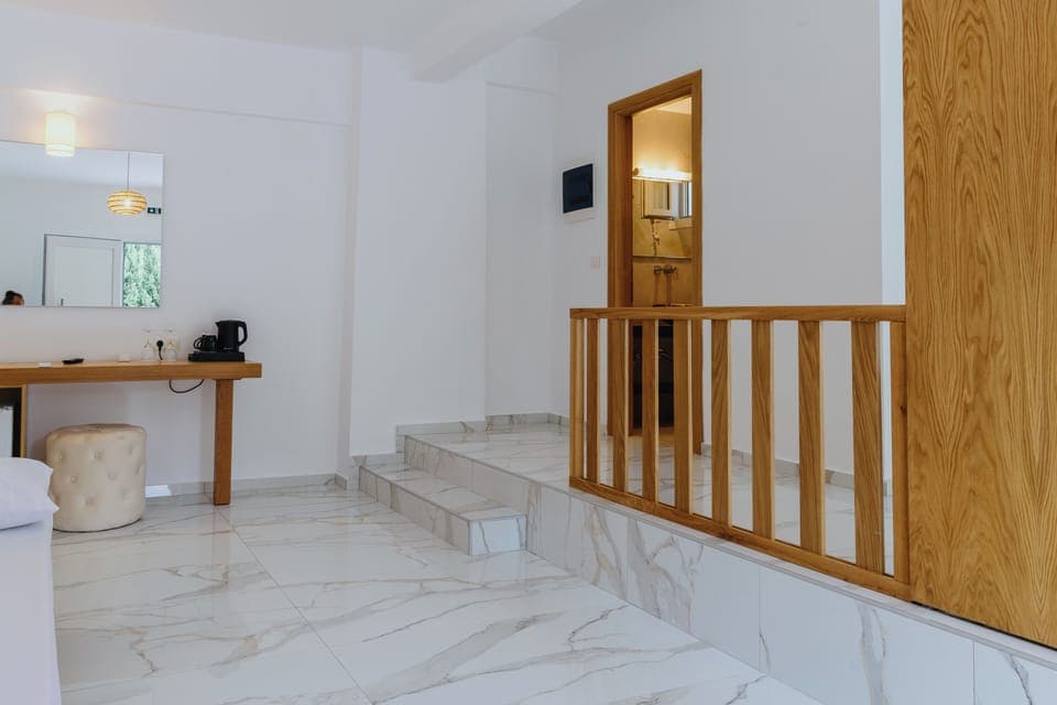 Standard Suite, Balcony, Pool View | In-room safe, blackout drapes, iron/ironing board, free WiFi