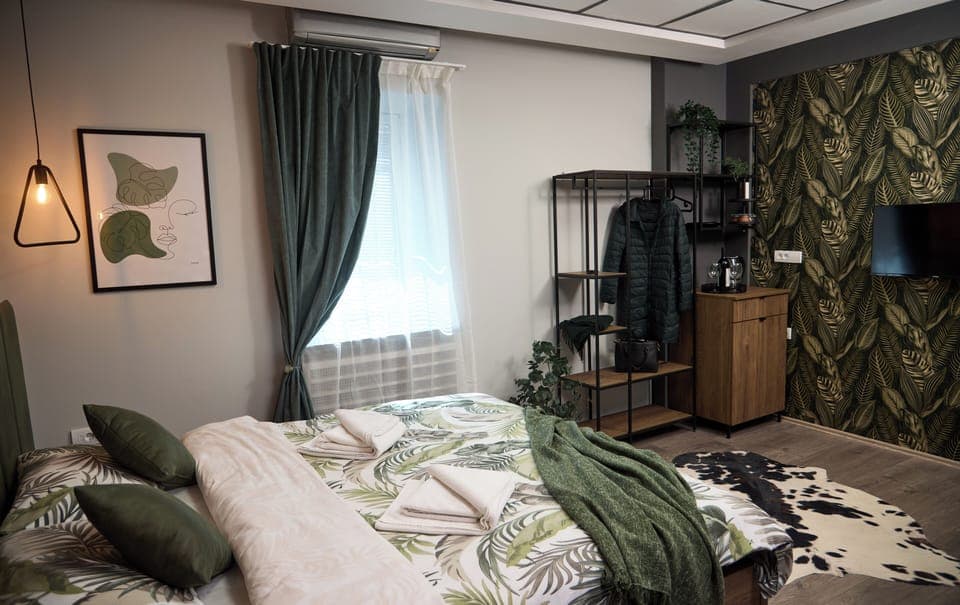 Laptop workspace, blackout drapes, soundproofing, iron/ironing board