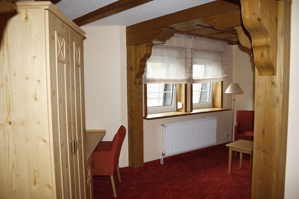 Comfort Quadruple Room | Living area | TV