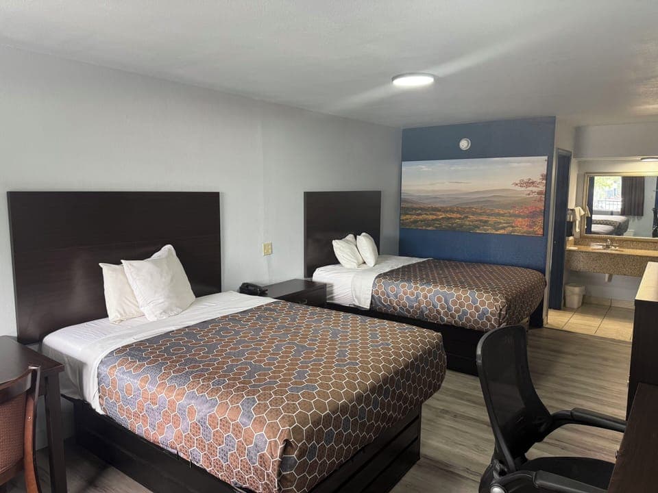 Room, 2 Queen Beds | Desk, laptop workspace, free WiFi