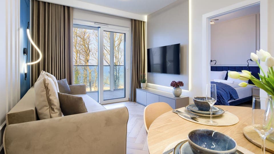 Apartament (218) with sea view | Living area | Flat-screen TV