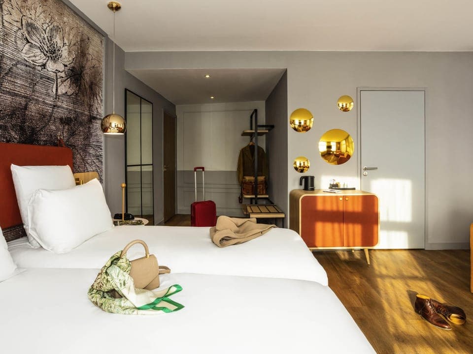 Family Room, Multiple Beds | Minibar, in-room safe, laptop workspace, blackout drapes