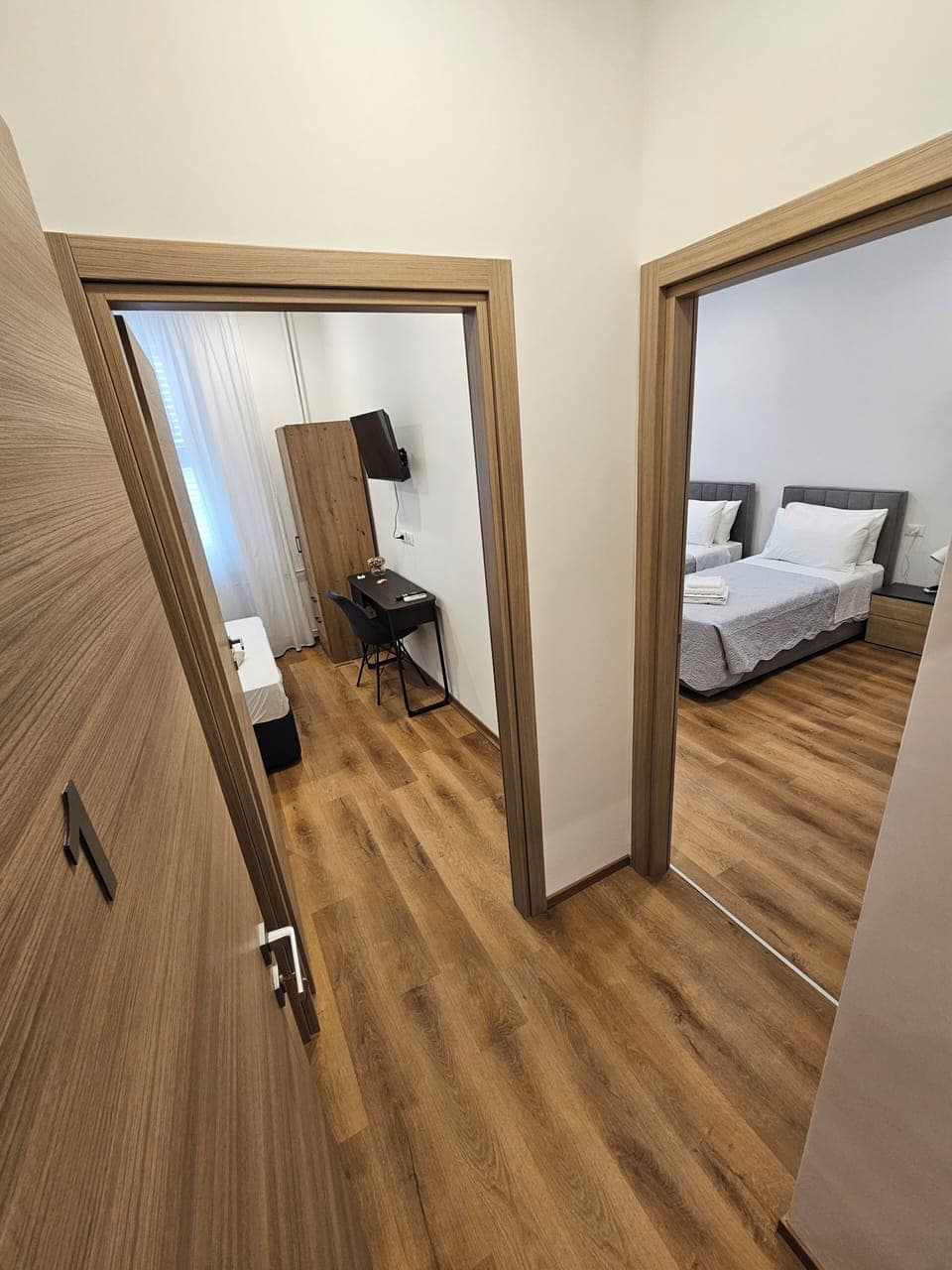 Comfort Triple Room, Private Bathroom | Desk, laptop workspace, blackout drapes, iron/ironing board