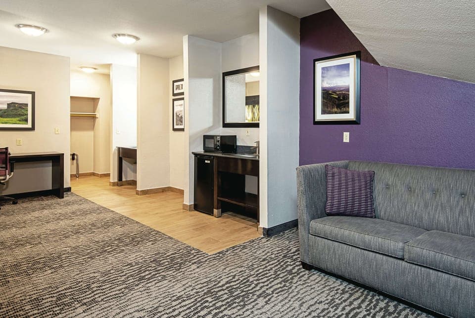 Premium bedding, desk, laptop workspace, blackout drapes