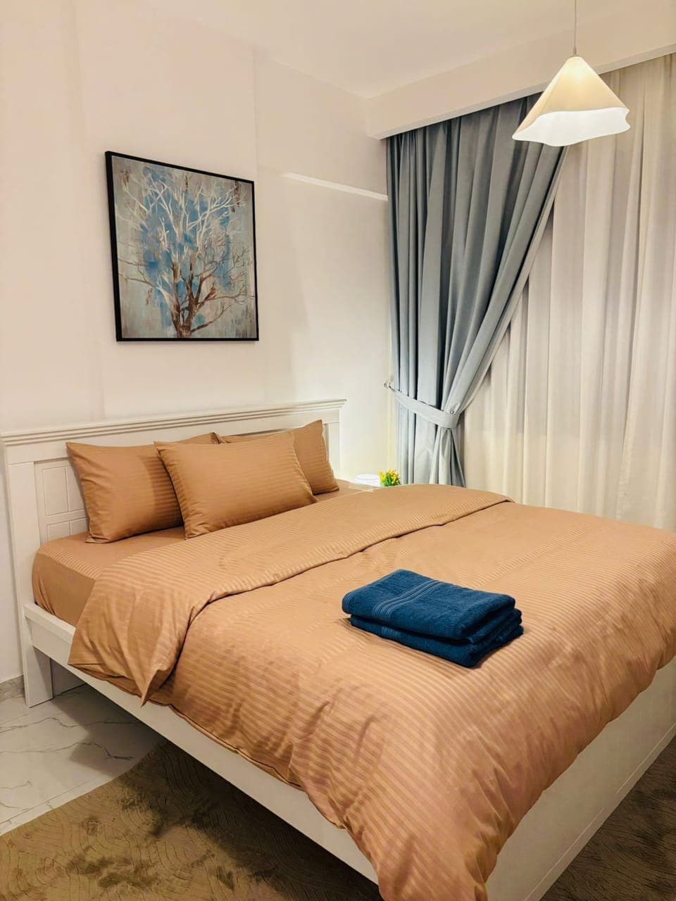 Premium bedding, desk, laptop workspace, soundproofing