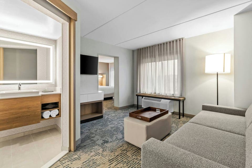 Suite, 1 King Bed with Sofa bed | Desk, laptop workspace, iron/ironing board, free WiFi