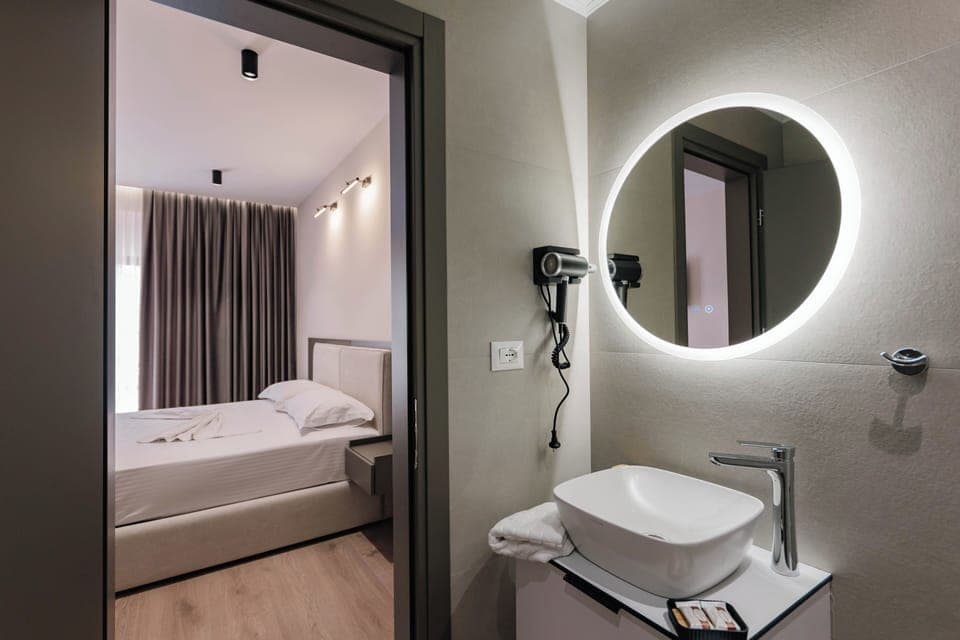 Triple Room | Bathroom | Shower, hair dryer, towels, soap