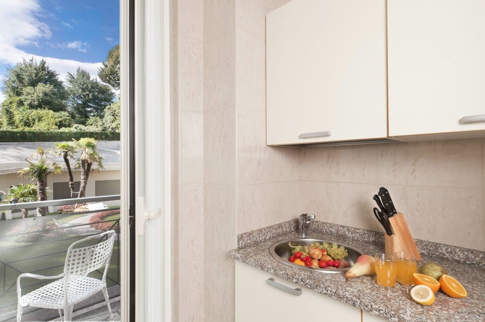 Two-Room Apartment (3/4 Persons) with 1 sofa bed, mountain side | Private kitchen | Full-size fridge, microwave, stovetop, coffee/tea maker