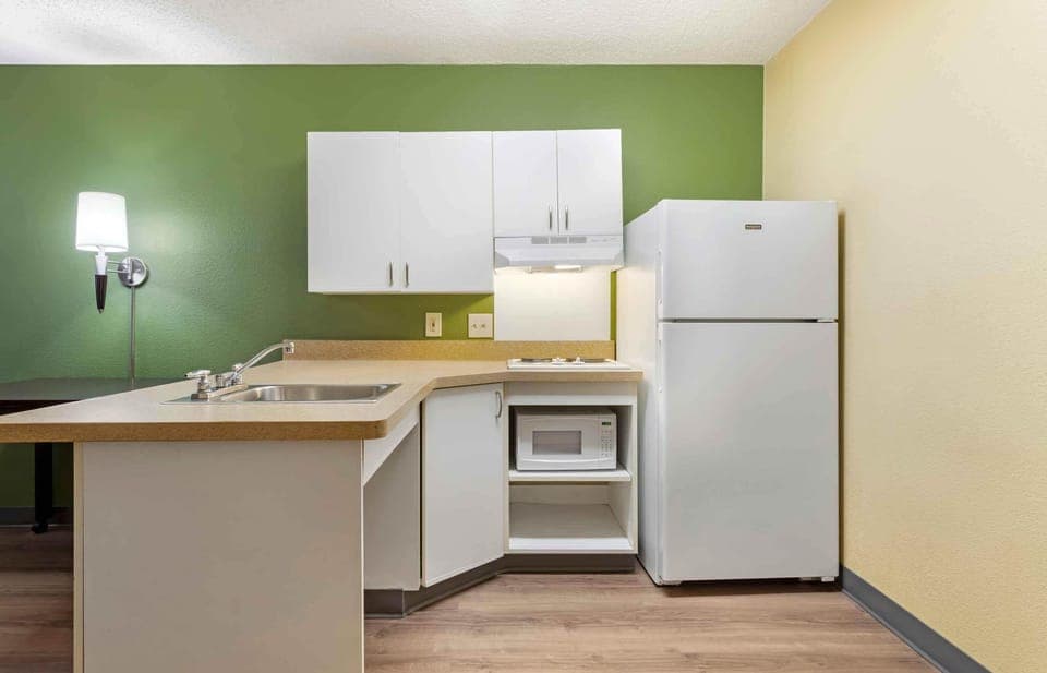 Fridge, microwave, stovetop, coffee/tea maker