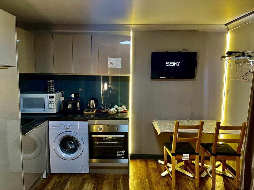 Two-Bedroom Apartment | Private kitchen | Mini-fridge, microwave, stovetop, coffee/tea maker