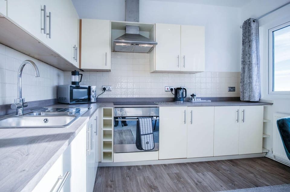 Microwave, oven, electric kettle, dining tables