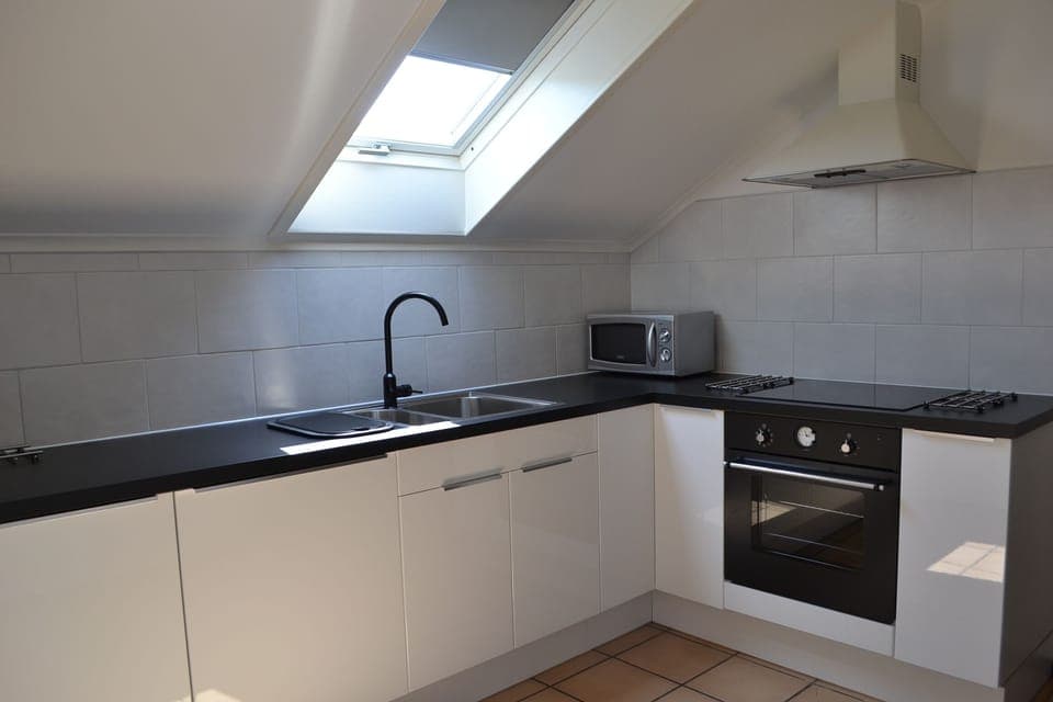 Apartment | Private kitchen | Fridge, microwave, stovetop, cookware/dishes/utensils