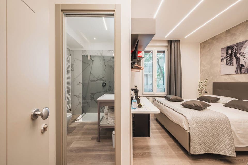 Comfort Triple Room, City View | Free minibar, in-room safe, desk, laptop workspace