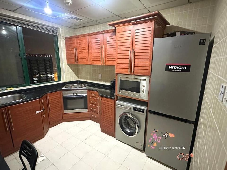 Economy Single Room, Balcony | Private kitchen | Fridge, microwave, stovetop