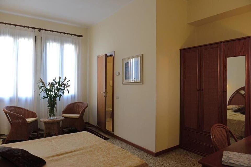 Junior Suite, Courtyard View | In-room safe, desk, iron/ironing board, free WiFi