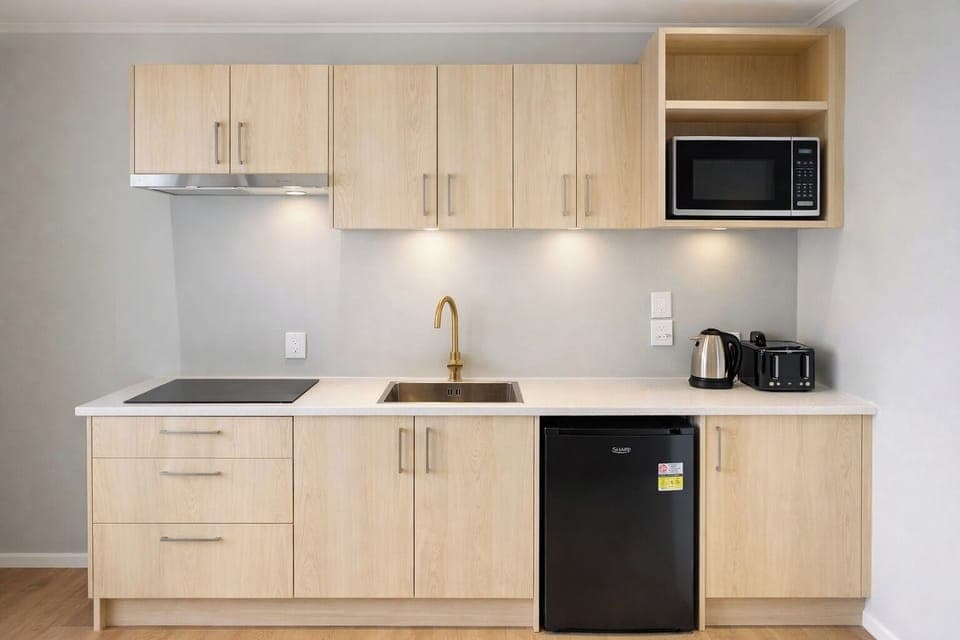 Mini-fridge, microwave, stovetop, cookware/dishes/utensils