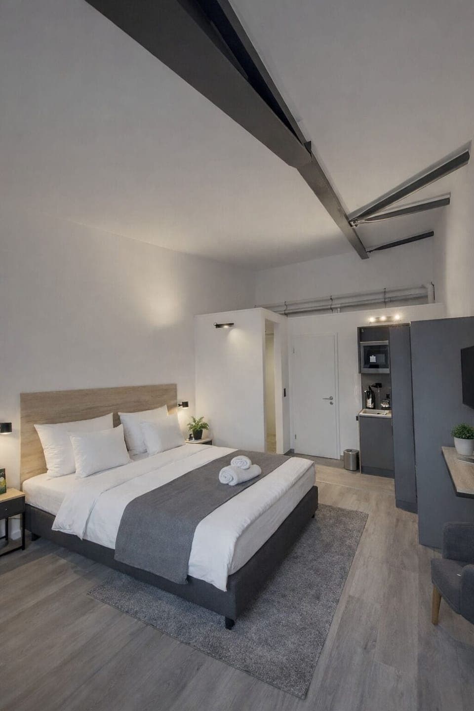 Deluxe Double Room, Kitchenette | Desk, laptop workspace, blackout drapes, soundproofing