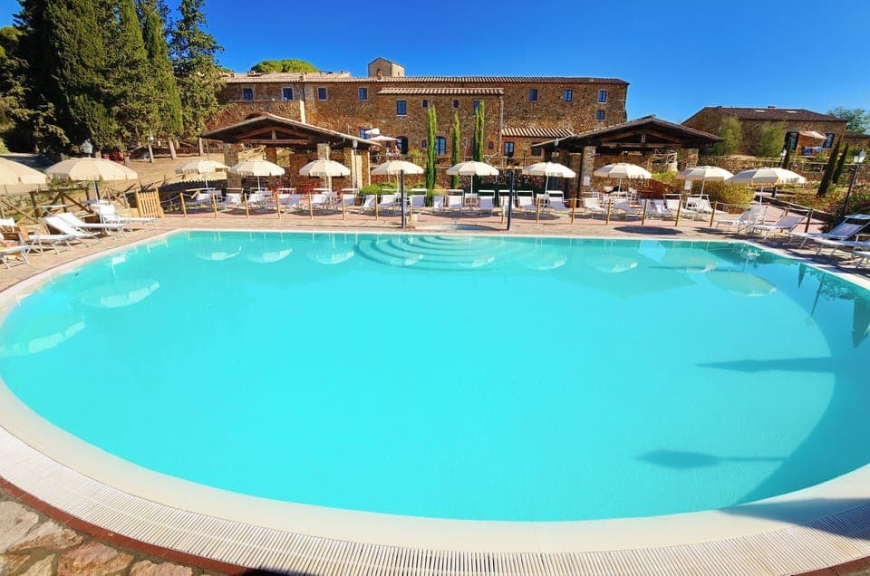 Seasonal outdoor pool, open 8:00 AM to 8:00 PM, pool umbrellas