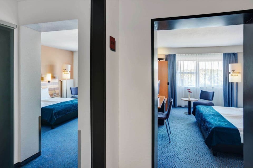 Family Room, 2 Queen Beds | Hypo-allergenic bedding, minibar, in-room safe, desk