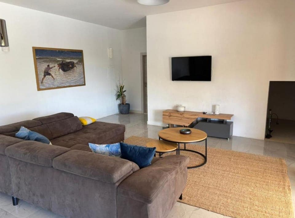 Villa (Four bedroom villa with pool) | Living room | 32-inch flat-screen TV with satellite channels