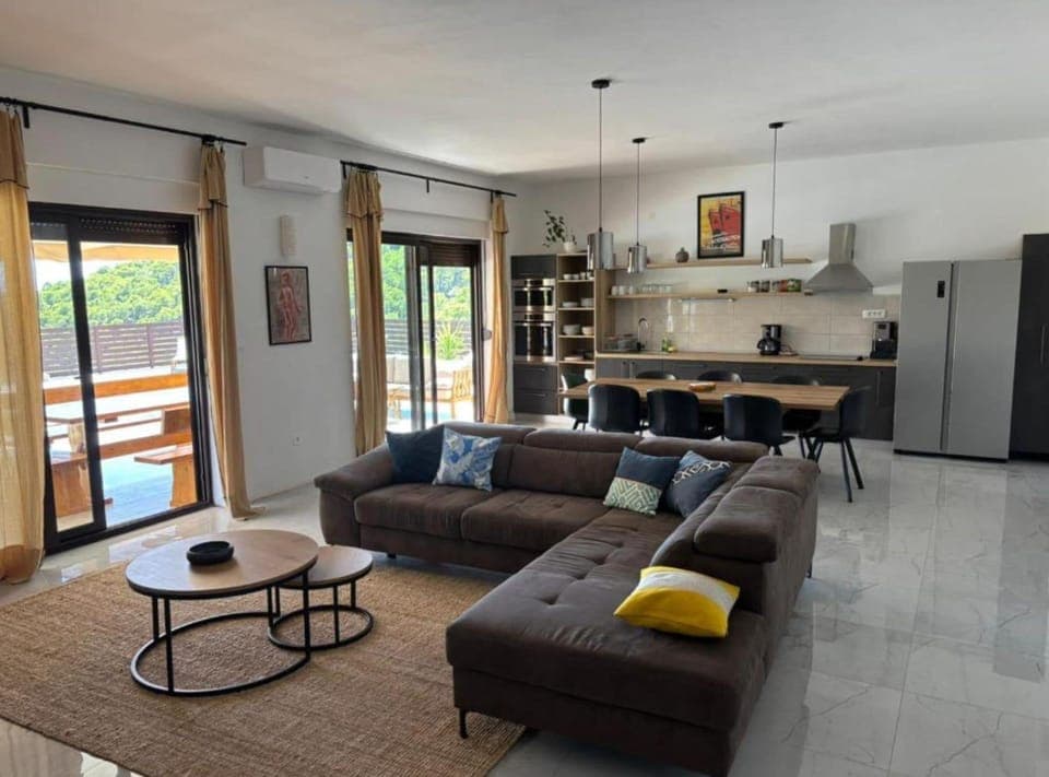 Villa (Four bedroom villa with pool) | Living room | 32-inch flat-screen TV with satellite channels