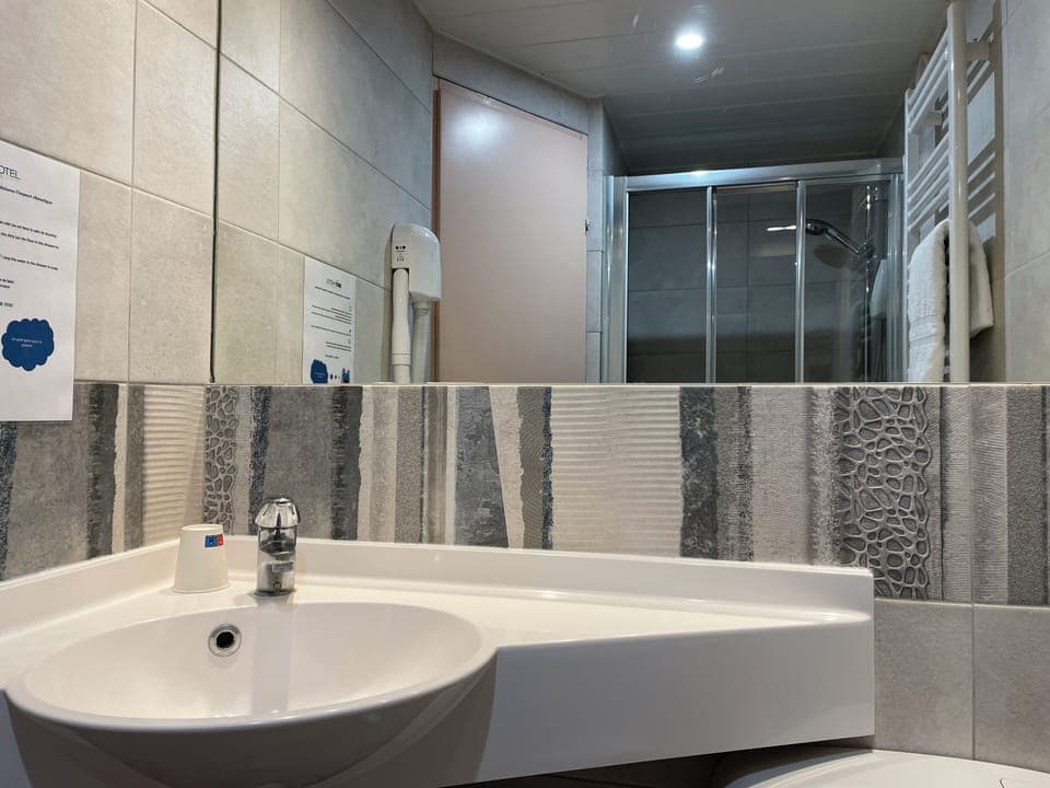 Shower, free toiletries, hair dryer, towels