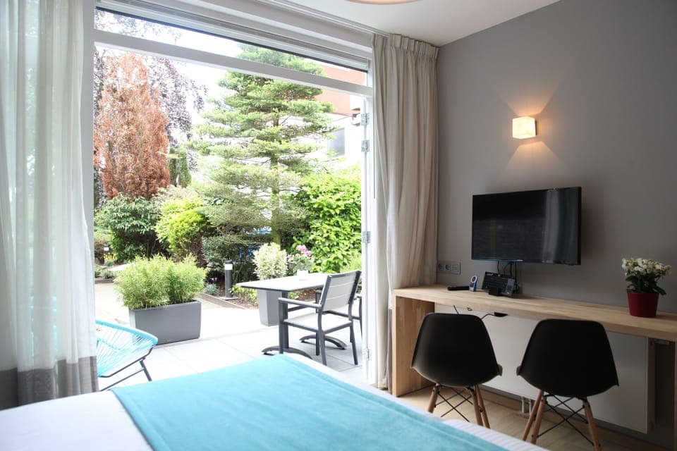 Deluxe Double Room, 1 Queen Bed, Terrace (Ground Floor) | Down comforters, in-room safe, desk, soundproofing