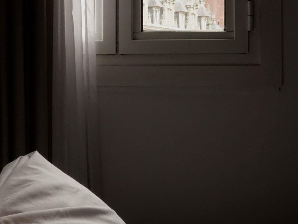 Down comforters, desk, blackout drapes, iron/ironing board